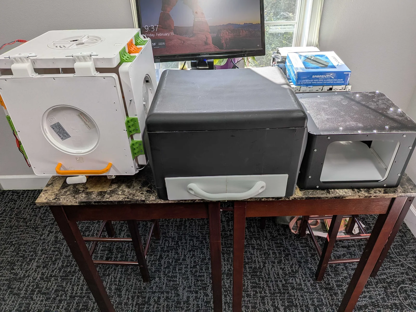 Three earlier photobox prototypes arranged side by side to show their progression