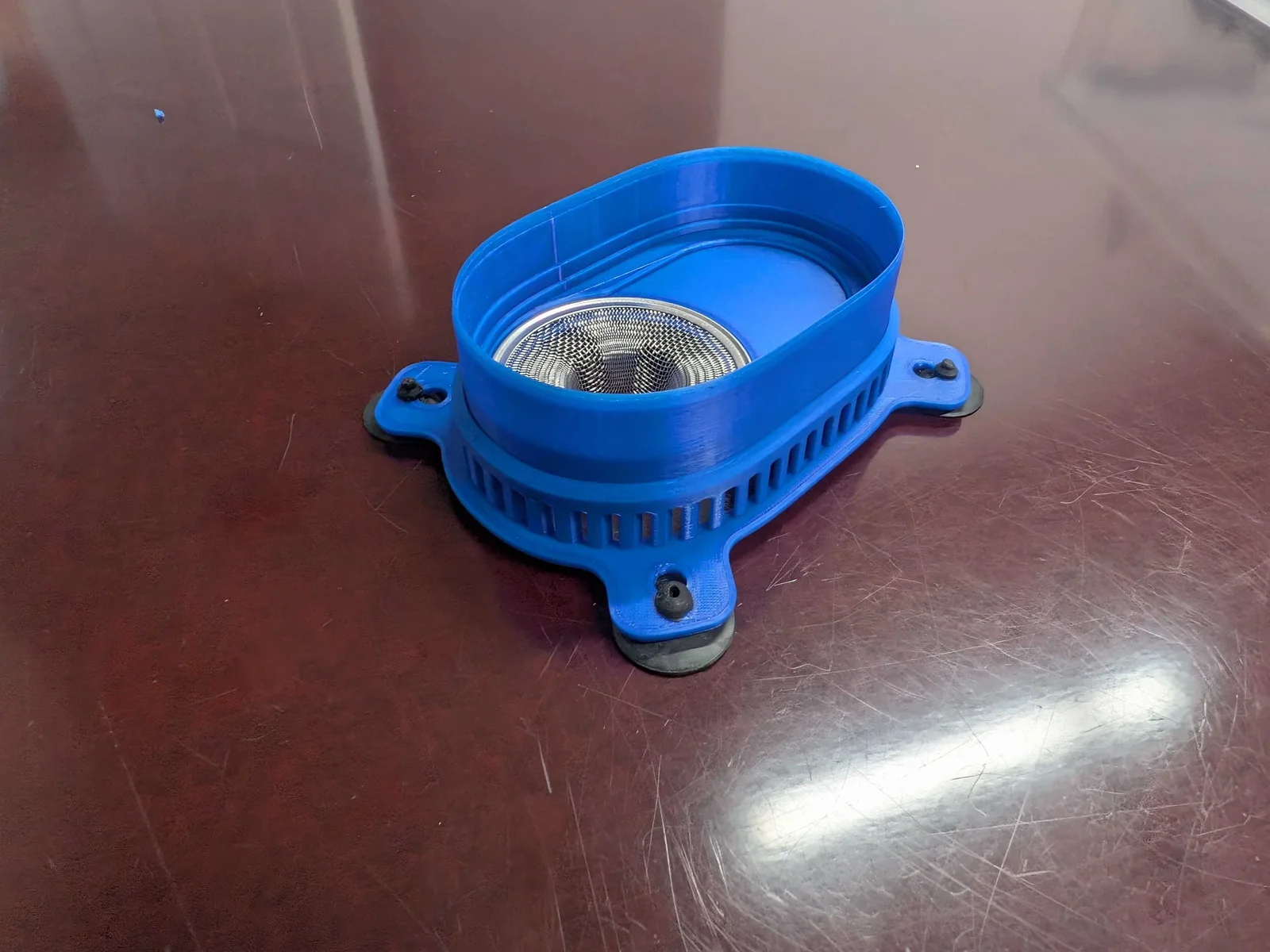 Printed blue filter housing with its secondary metal basket filter installed